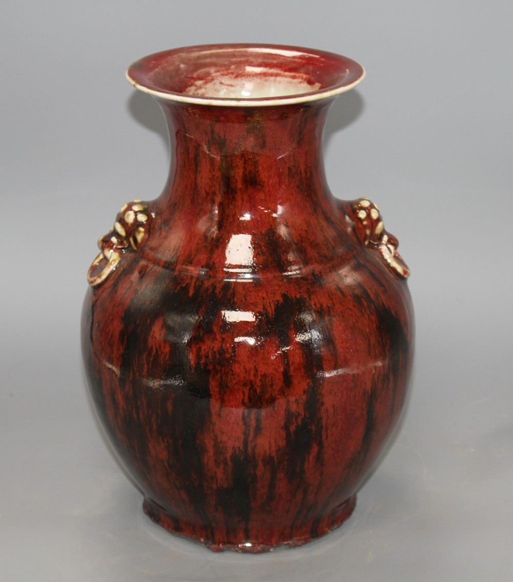 A Chinese flambe vase, with lion mask ring handles to the shoulder, H. 28.5cm